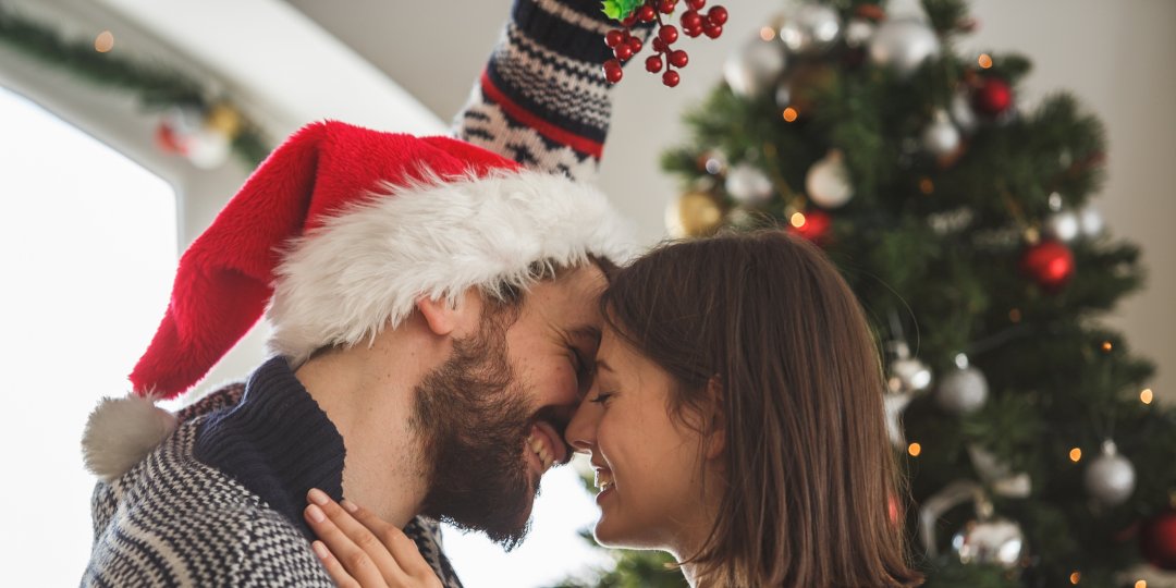 Why We Kiss underneath the Mistletoe (and How to still do it This Year)